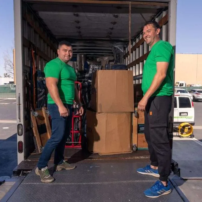 our team crew loading boxes into the truck